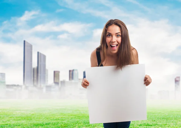 Woman holding a white banner — Stock Photo, Image