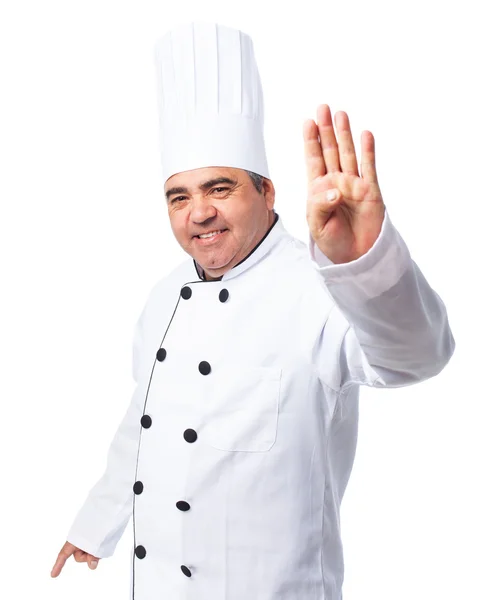 Homem cozinheiro fazendo um número quatro — Fotografia de Stock