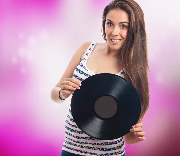 Young woman holding a vinyl — Stock Photo, Image