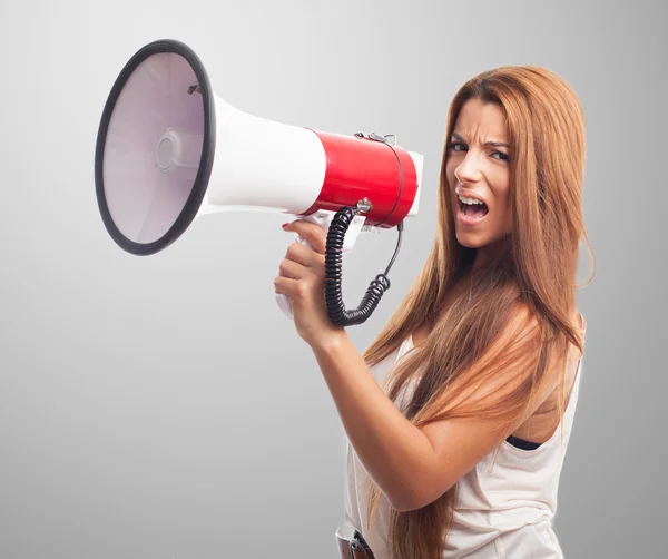Woman shouting with a megaphone — Stock Photo, Image