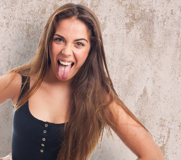 Girl showing her tongue — Stock Photo, Image