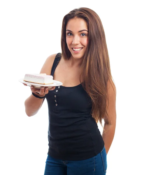 Woman holding a dish with a cake — Stock Photo, Image