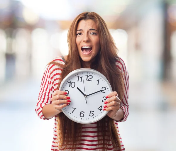 Woman holding a clock — Stock Photo, Image
