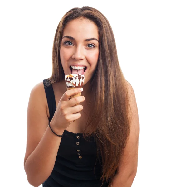 Young woman licking an ice cream — Stock Photo, Image