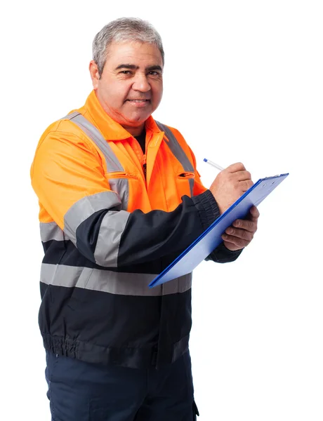 Arbeiter schreibt auf Papier — Stockfoto