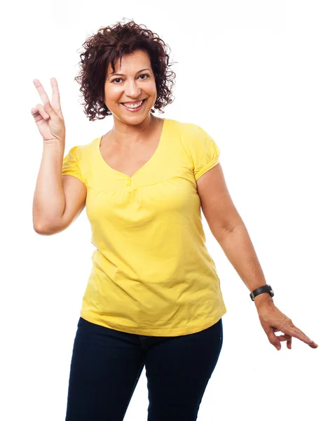 Mature woman doing a victory gesture — Stock Photo, Image