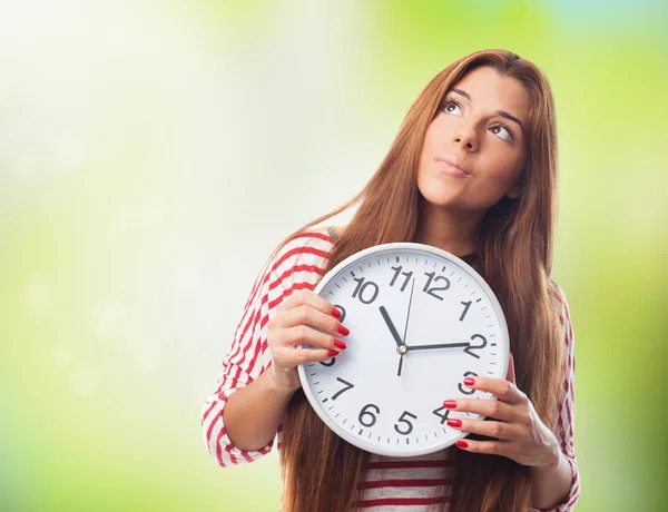 Woman holding a clock — Stock Photo, Image