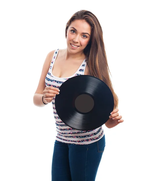 Mulher segurando um vinil — Fotografia de Stock