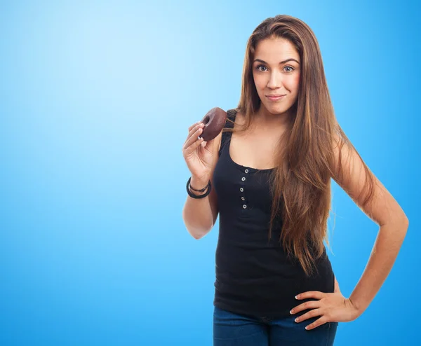 Woman holding a donut — Stock Photo, Image