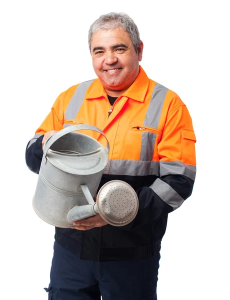 Gardener holding a watering can — Stock Photo, Image