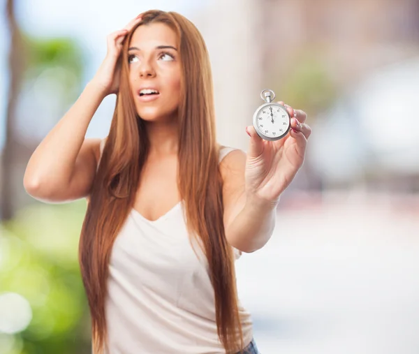 Woman holding a stopwatch — Stock Photo, Image