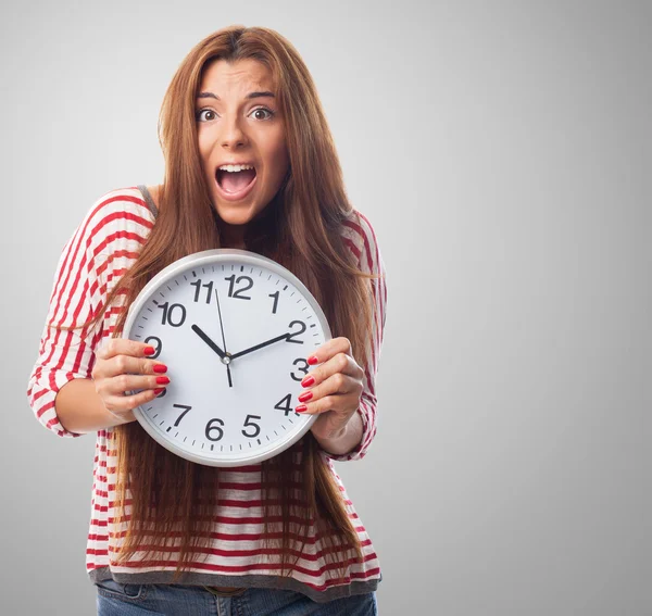 Woman holding a big clock — Stock Photo, Image
