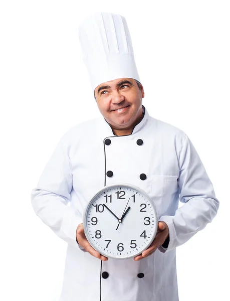 Cook man holding a clock — Stock Photo, Image