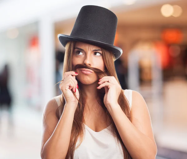 Pretty girl imitating a man — Stock Photo, Image