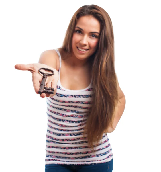 Girl holding a vintage key — Stock Photo, Image