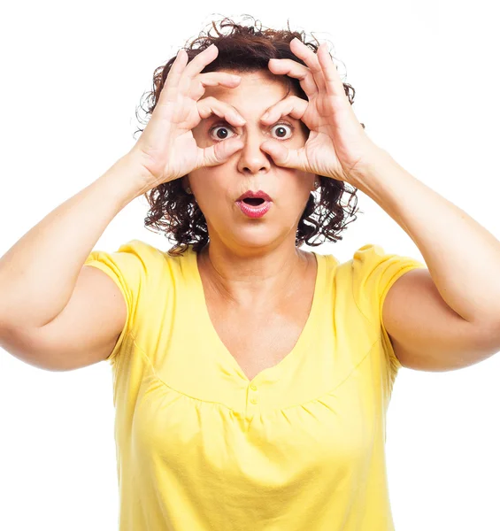 Woman doing a glasses gesture — Stock Photo, Image