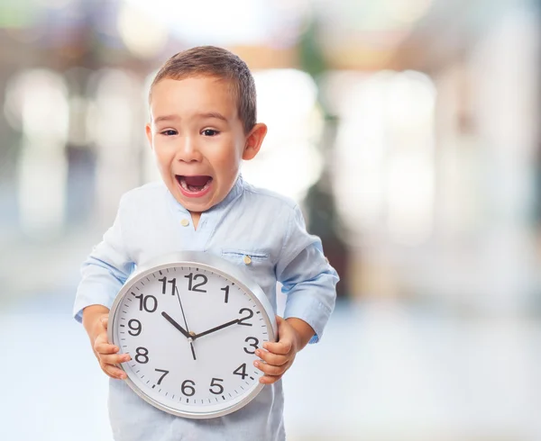 Boy holding a clock — Stock Photo, Image