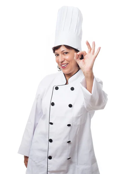 Mature woman ready to cook over white — Stock Photo, Image