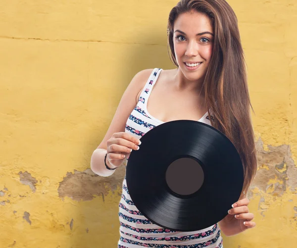 Young woman holding a vinyl — Stock Photo, Image