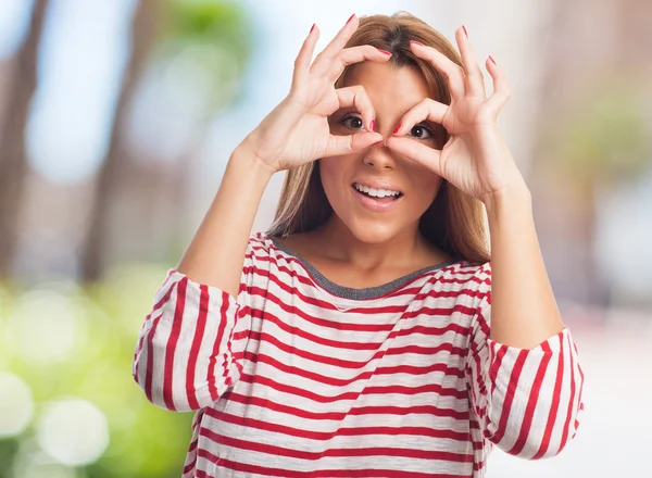 Žena, která dělá gesto brýle — Stock fotografie