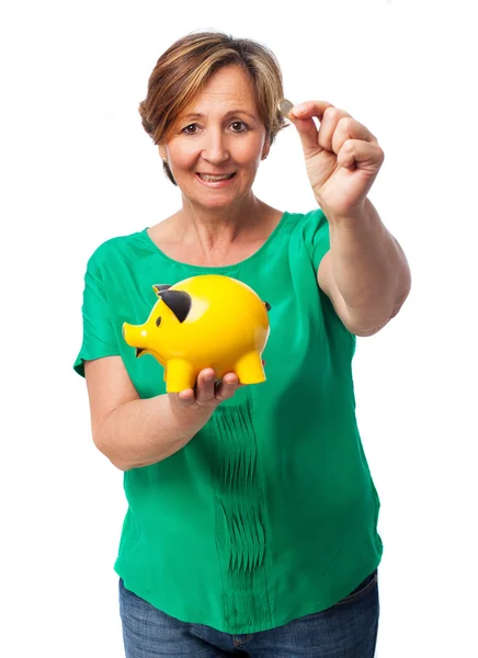 Woman with her piggy bank — Stock Photo, Image
