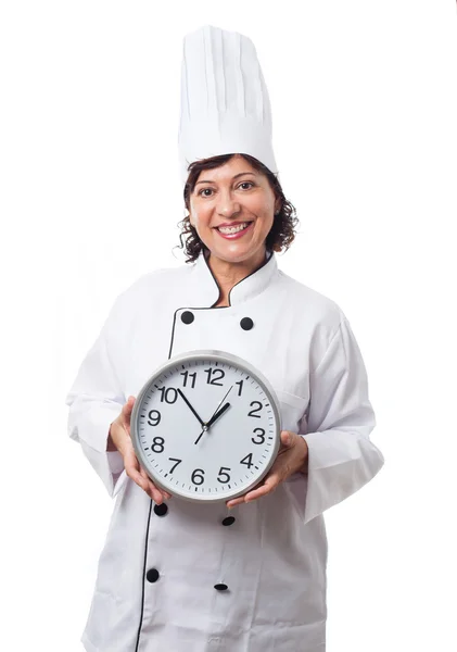 Woman holding a clook over white — Stock Photo, Image