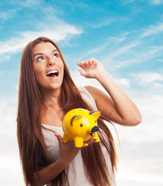 Woman holding a piggy bank — Stock Photo, Image