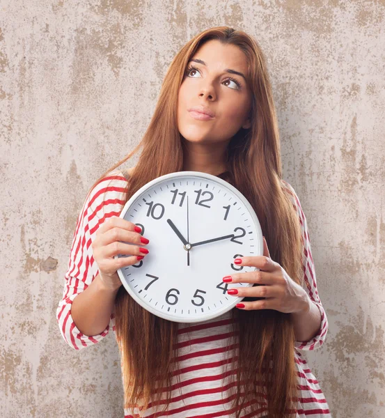 Woman holding a clock — Stock Photo, Image