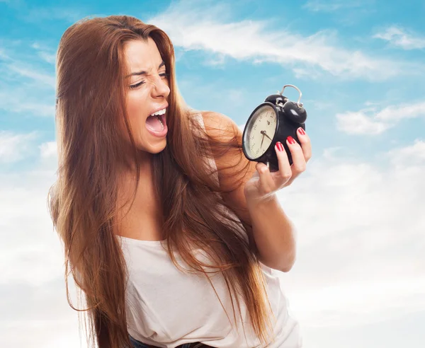 Student screaming to alarm clock — Stock Photo, Image