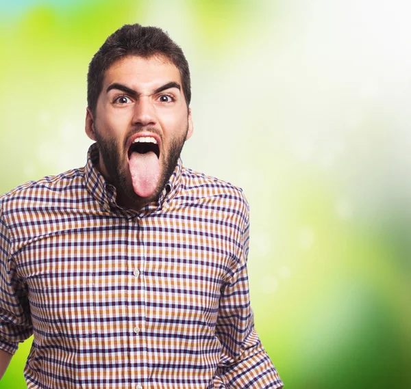 Muž ukazující jeho jazyk — Stock fotografie
