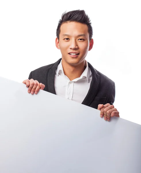 Young man holding a banner — Stock Photo, Image