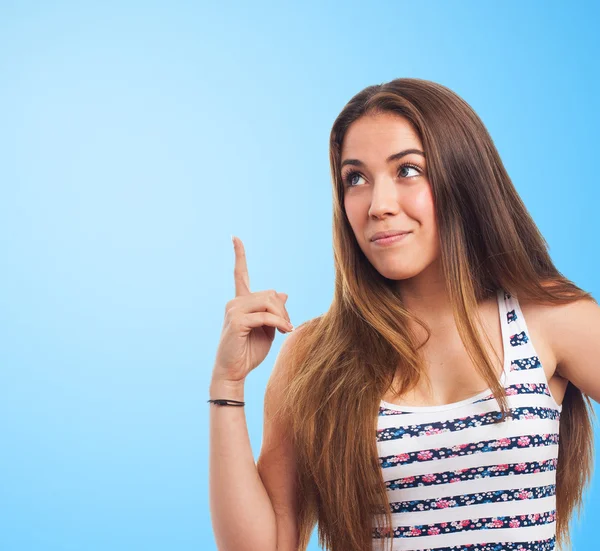 Young woman pointing up — Stock Photo, Image