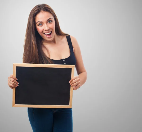 Student holding a chalkboard — Stock Photo, Image