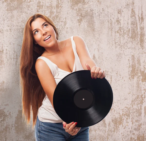 Mujer sosteniendo un vinilo —  Fotos de Stock