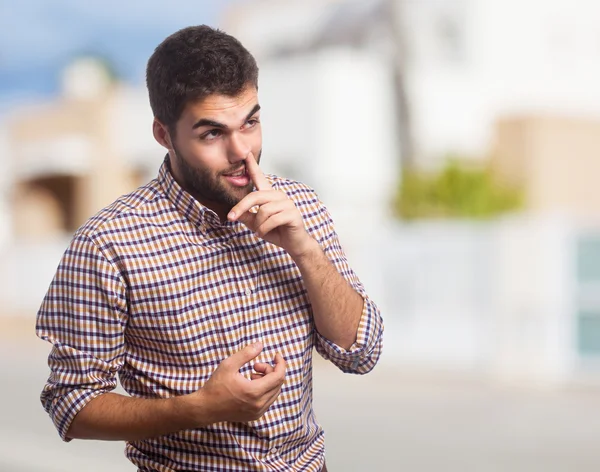 Hombre con el dedo en la nariz — Foto de Stock