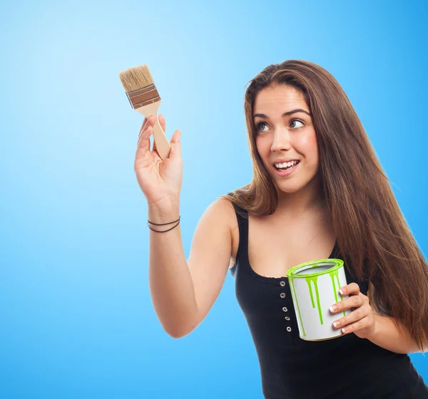 Woman holding a paint can — Stock Photo, Image