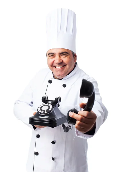 Cook man talking on telephone — Stock Photo, Image
