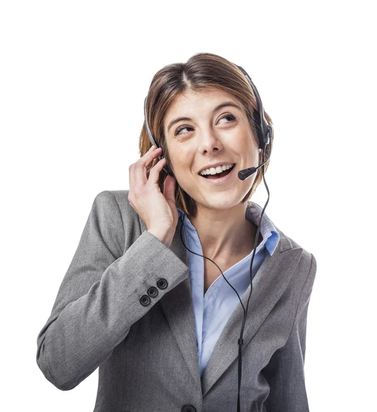Mulher de negócios falando em um fone de ouvido — Fotografia de Stock