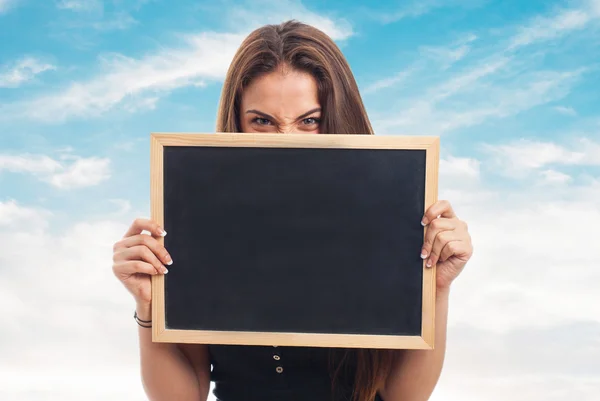 Girl behind of a chalkboard — Stock Photo, Image