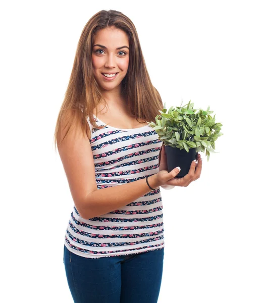 Girl holding a plant — Stock Photo, Image