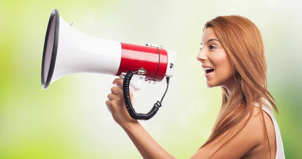 Woman shouting through megaphone — Stock Photo, Image
