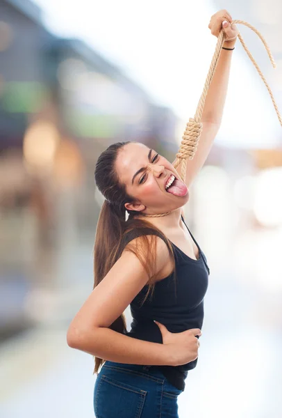 Woman hanging with a rope — Stock Photo, Image