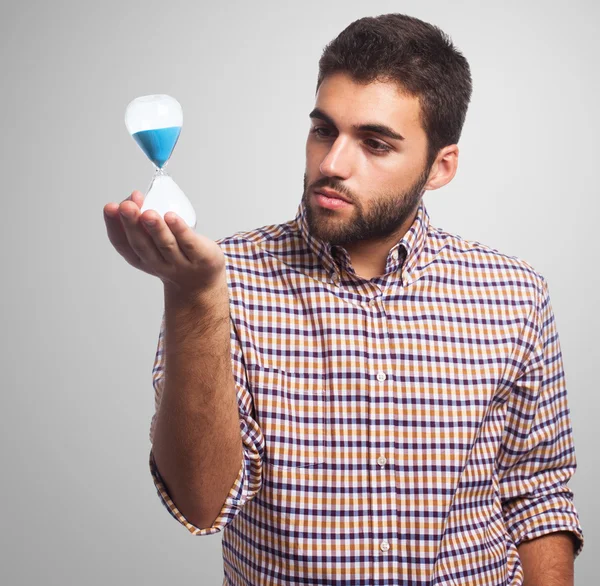 Man holding a sand timer — Stock Photo, Image