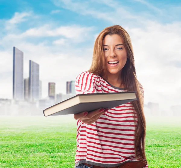 Woman giving a book — Stock Photo, Image