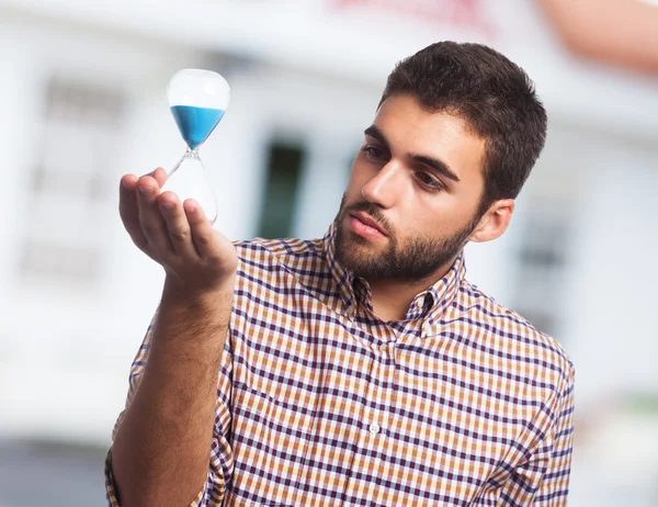 Man holding a sand timer — Stock Photo, Image