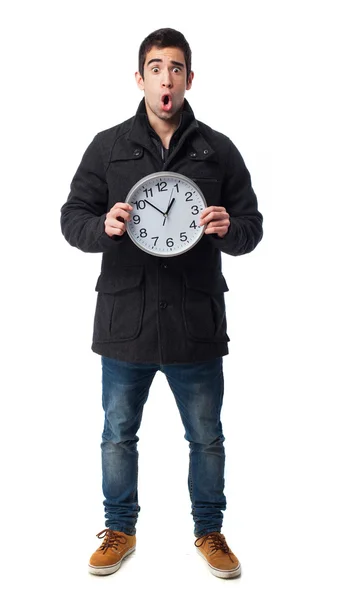 Man holding a clock — Stock Photo, Image