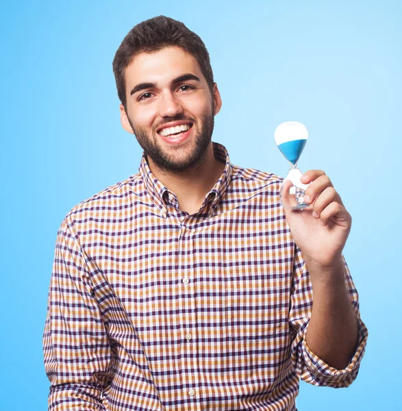 Man holding a sand timer — Stock Photo, Image