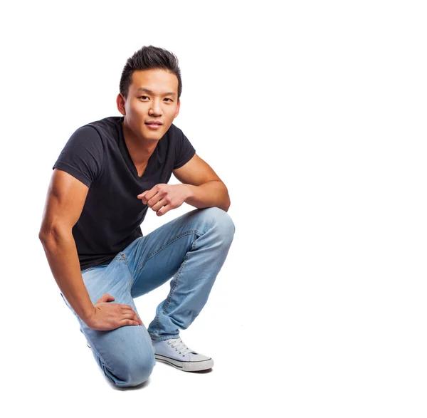 Asijské muž sedící — Stock fotografie