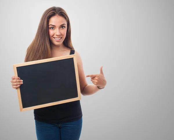 Woman holding a chalkboard — Stock Photo, Image