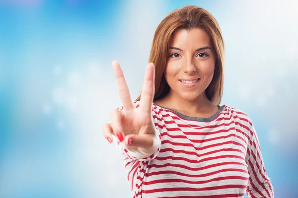 Woman doing a victory symbol